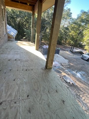 EPDM membrane around a deck post and wall transition