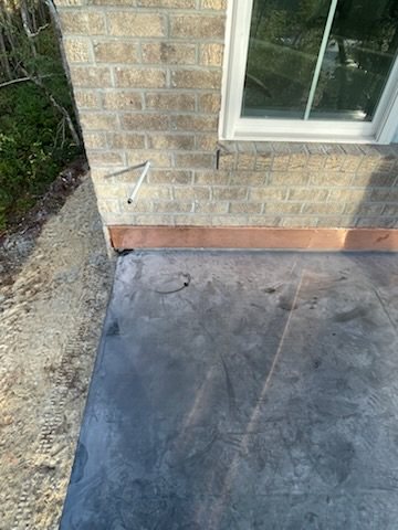 Low-slope membrane work shown beside deck framing and exterior wall details