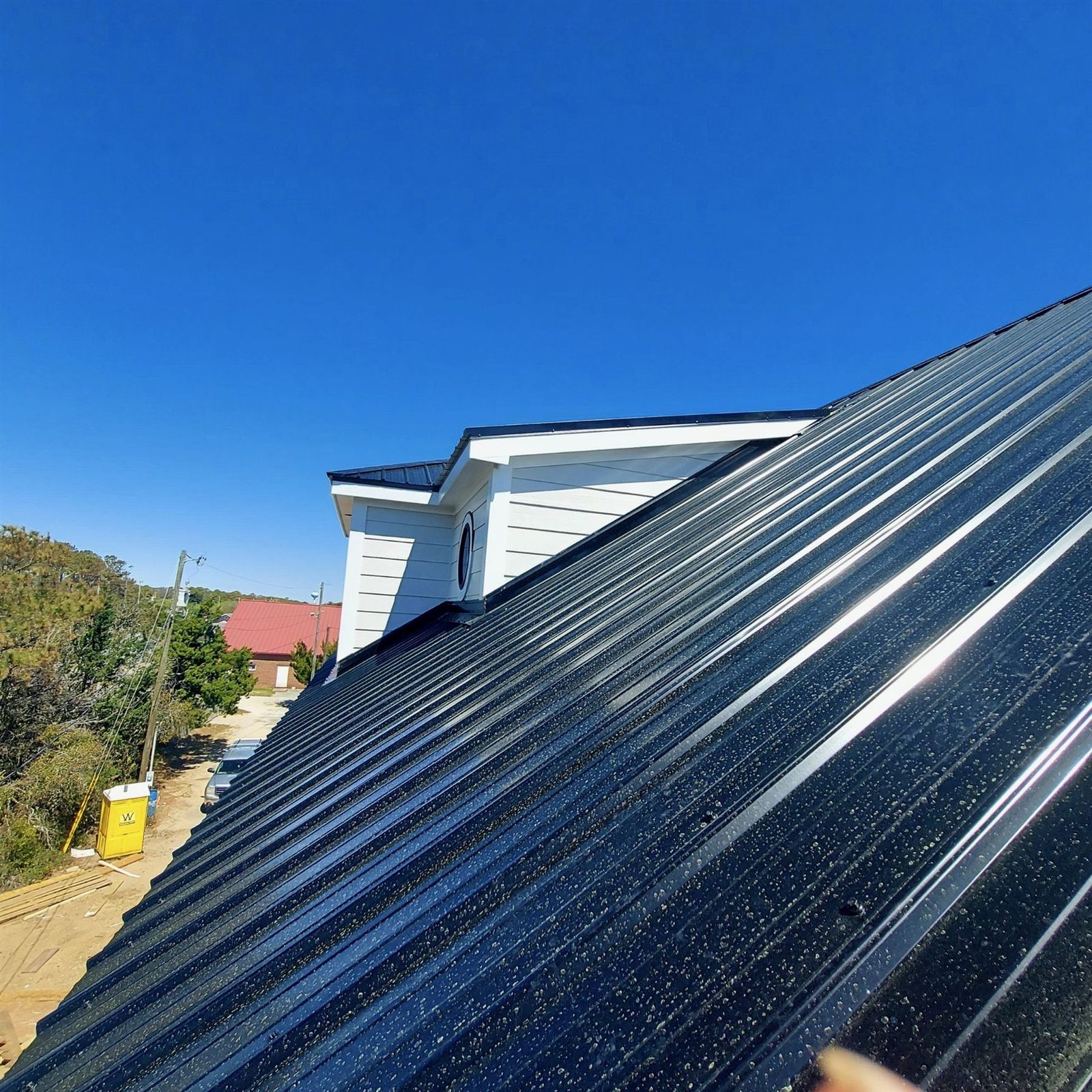 Dark metal roof panel close-up