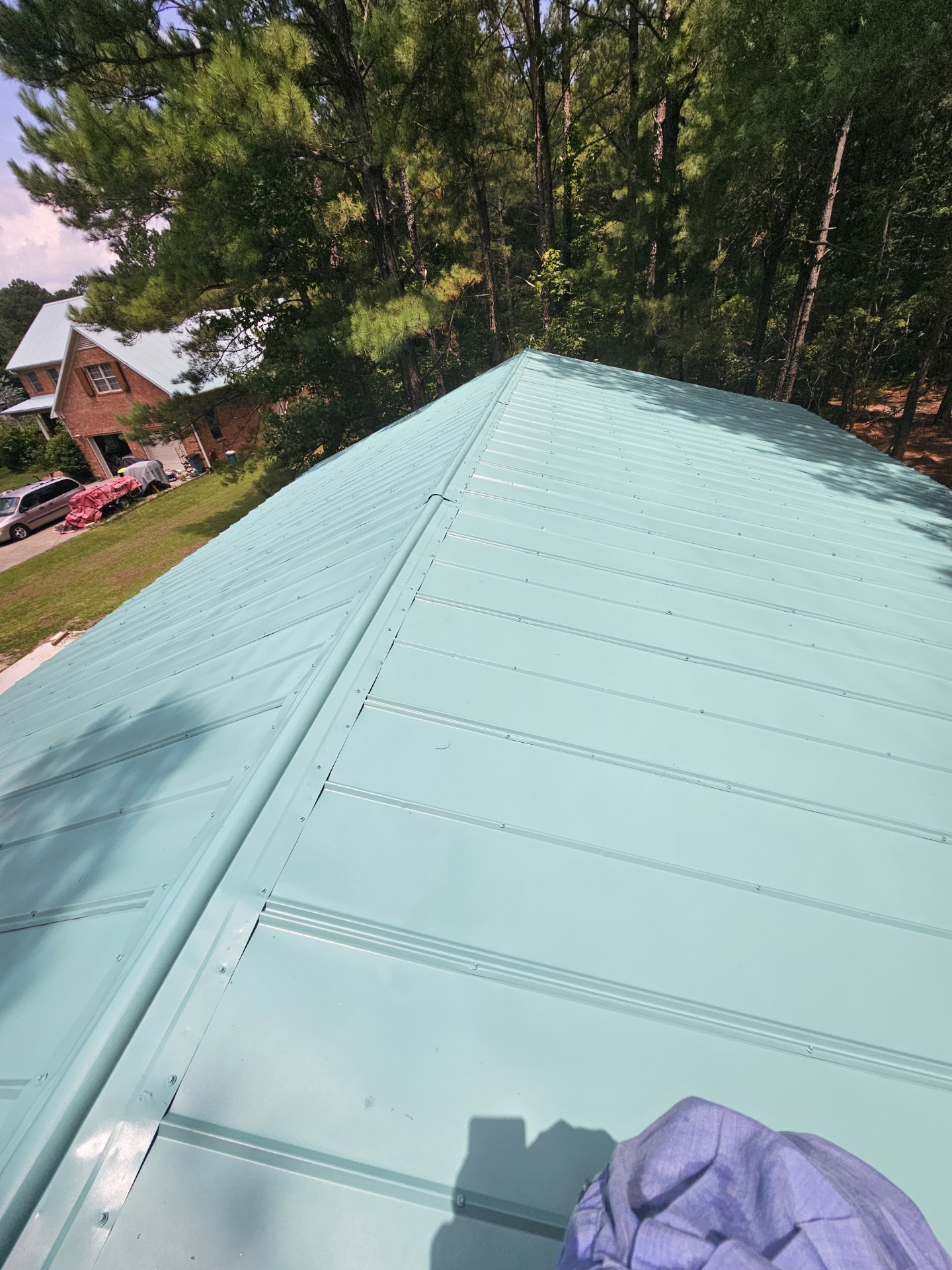 Finished teal metal roof ridge detail